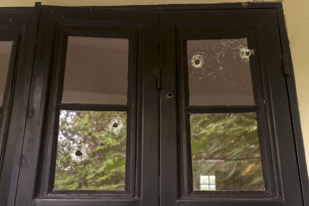 3 2016 and released by Adriane Ohanesian bullet holes are seen in the window of a room at the Terrain compound after