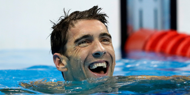 United States Michael Phelps reacts after the men's 100-meter butterfly final during the swimming competitions at the 2016 Summer Olympics