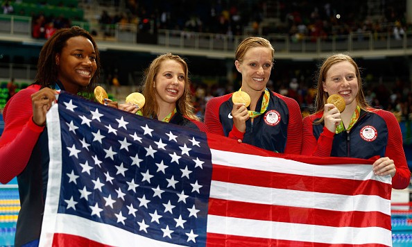 RIO DE JANEIRO BRAZIL- AUGUST 13 Kathleen Baker Lilly King Dana Vollmer Simone Manuel of the United States pose during the medal ceremony for the Women's 4 x 100m Medley Relay Final on Day 8 of the Rio 2016 Olympic Games at the Olympic Aquatic