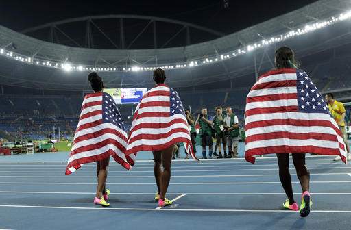 Miami's Rollins wins gold, leads USA sweep in 100 hurdles