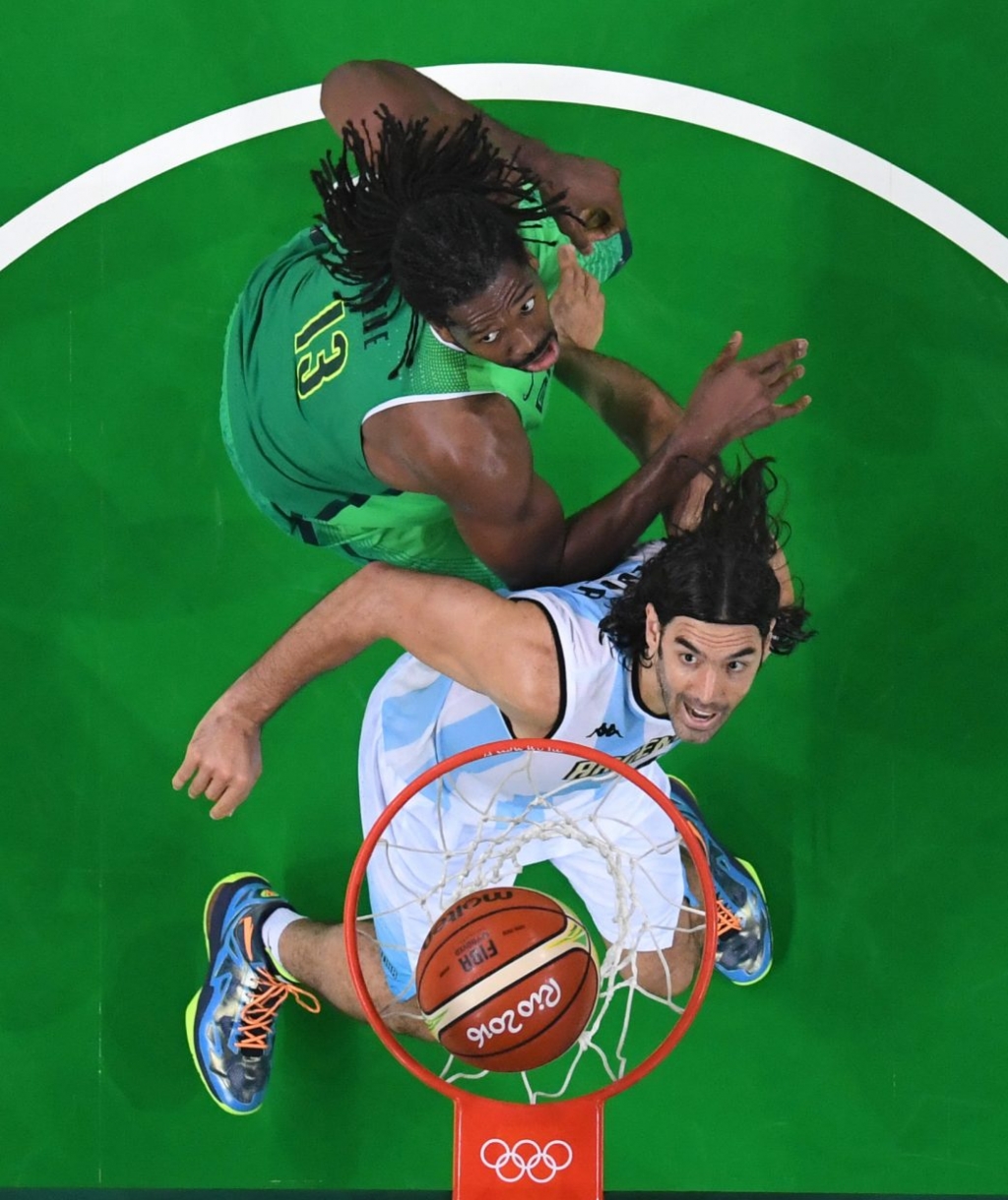 Argentina's Luis Scola bottom scores past Brazil's Nene Hilario during a men's basketball game at the 2016 Summer Olympics in Rio de Janeiro Brazil Saturday Aug. 13 2016