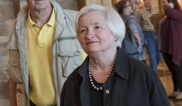 Janet Yellen chair of the US Federal Reserve right arrives for a western themed dinner during the Jackson Hole