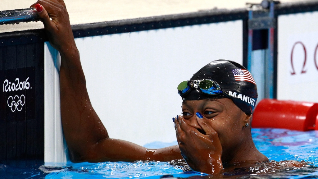 Simone Manuel of the United States celebrates after winning gold in the women's 100-meter freestyle at the Rio 2016 Summer Olympics