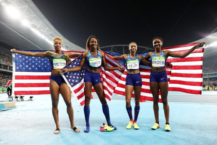 Natasha Hastings Phyllis Francis Allyson Felix and Courtney Okolo of the United States pose after winning gold in the Women's 4x400 relay