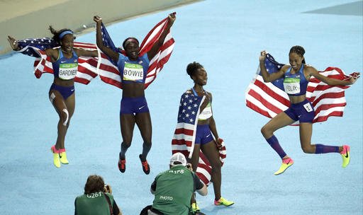 The United States team from left English Gardner Tori Bowie Tianna Bartoletta and Allyson Felix celebrate winning the gold medal in the women's 4x100-meter relay final during the athletics competitions of the 2016 Summer Olympics at the Olympic stadium