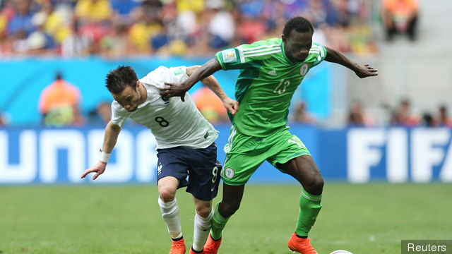 Nigeria's Juwon Oshaniwa in action with France's Mathieu Valbuena