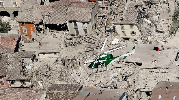 Rescuers search amid rubble following an earthquake in Amatrice central Italy on Wednesday. The magnitude 6.0 quake struck at 3:36 a.m. local time and was felt across a broad swath of central Italy including Rome where residents of the capital felt a