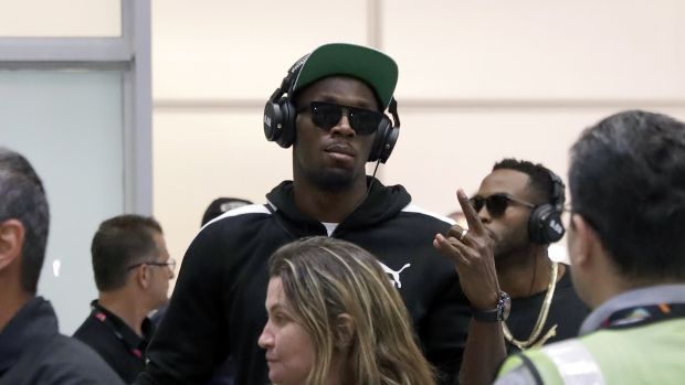 Jamaican Olympic runner Usain Bolt center gestures while arriving at Rio