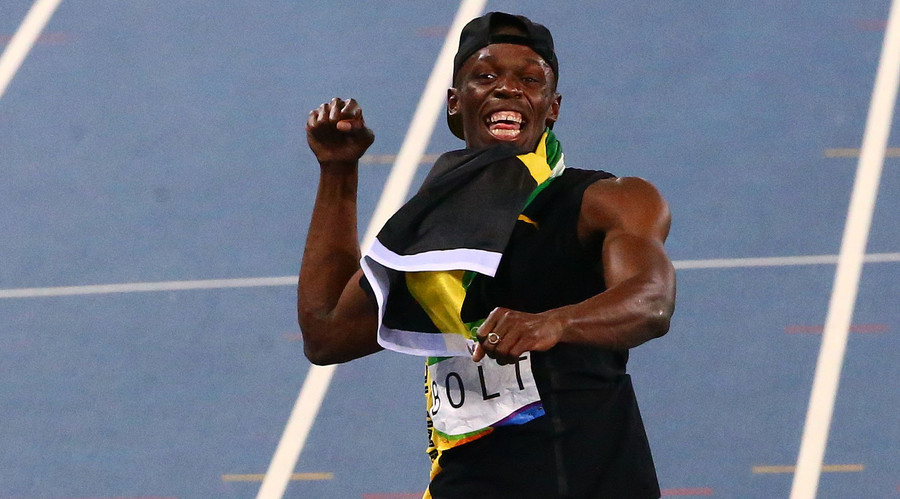 Usain Bolt of Jamaica celebrates after the team won the race