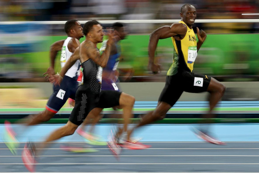 Bolt not only won the race with an amazing velocity in the last meters of the 100m race but he also had time to look at the camera and vitoring. Image Credit Slate