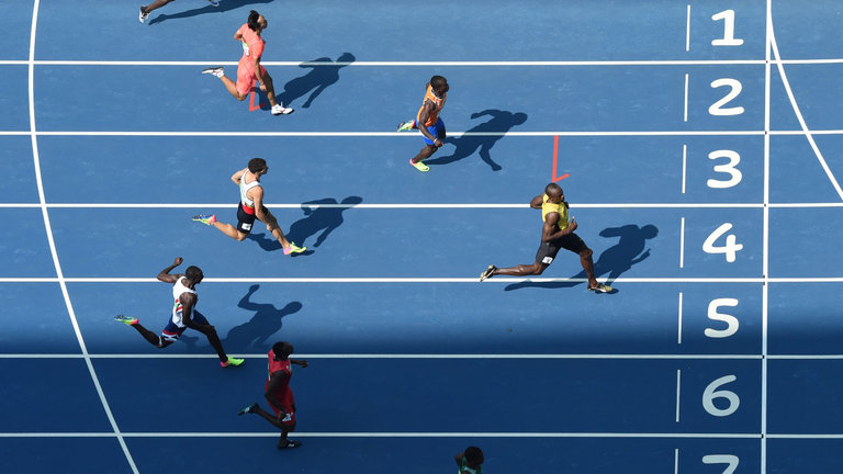 Usain Bolt eases down on his way to victory in the 200m heats in Rio on Tuesday