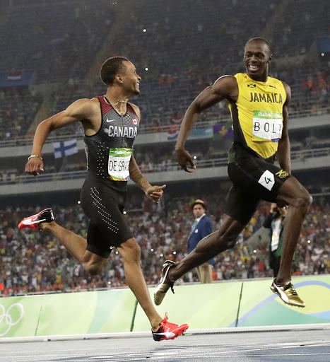 Canada's Andre De Grasse left and Jamaica's Usain Bolt smile at each other in a men's 200-meter semifinal during the athletics competitions of the 2016 Summer Olympics at the Olympic stadium in Rio de Janeiro Brazil Wednesd