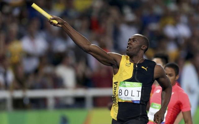 Usain Bolt of Jamaica celebrates after winning the gold in men's 4x100 metres relay. Reuters