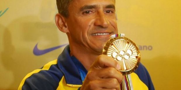 Vanderlei Cordeiro de Lima shows off his actual Pierre de Coubertin medal