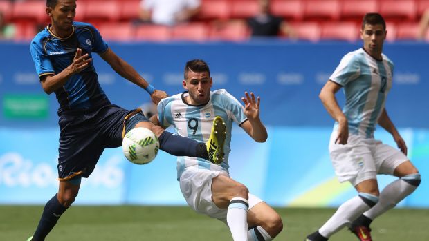 Vargas Allans of Honduras and Calleri Jonathan of Argentina go into contact