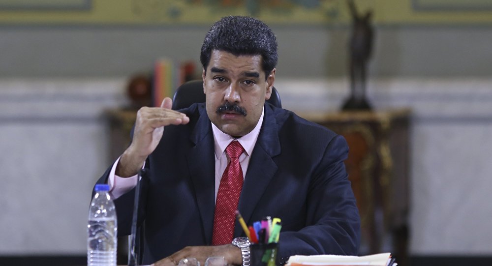 Venezuela's President Nicolas Maduro speaks during a meeting with deputies of Venezuela's United Socialist Party and ministers at Miraflores Palace in Caracas in this handout