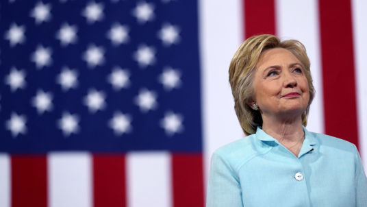 MIAMI FL- JULY 23 Democratic presidential candidate former Secretary of State Hillary Clinton looks on as her running mate Democratic vice presidential candidate U.S. Sen. Tim Kaine speaks during a campaign rally at Florida International Univers