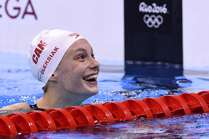 Canada's Penny Oleksiak reacts after she won the women's 100m freestyle final during the swimming event at the Rio 2016 Olympic Games at the Olympic Aquatics Stadium in Rio de Janeiro