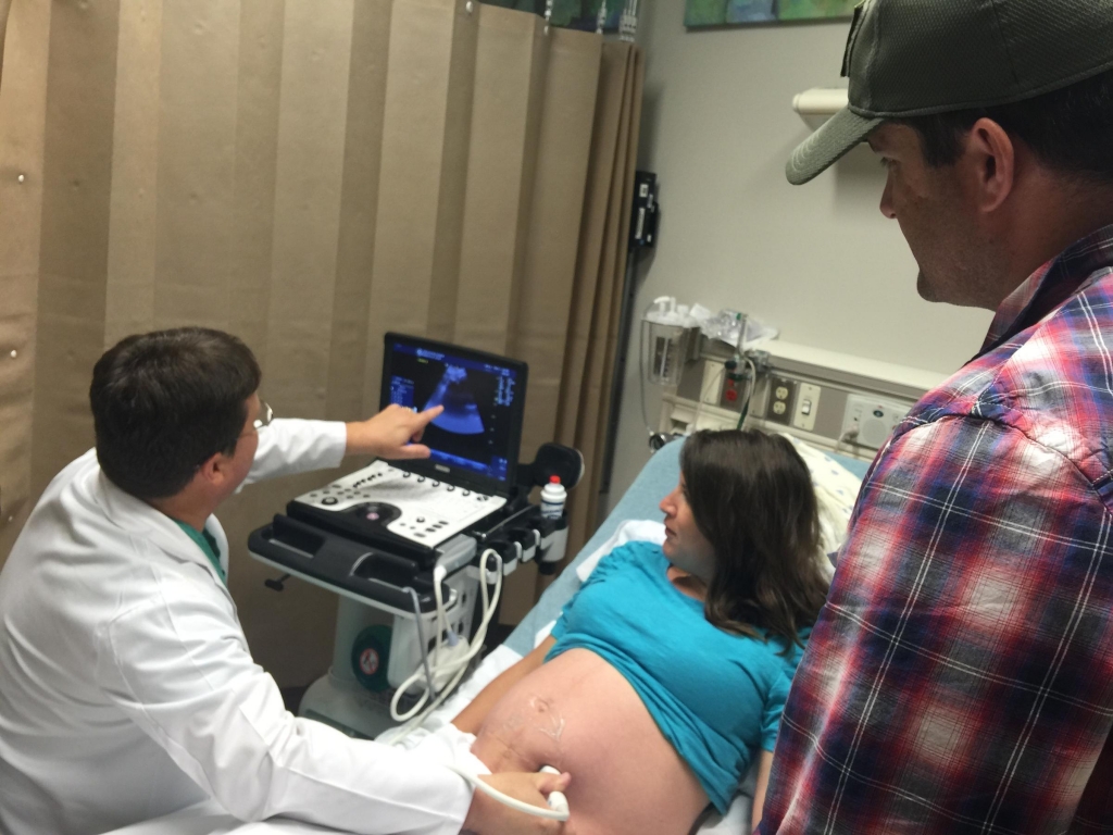 Elizabeth Viccellio listens to the heart beat of her unborn baby by doppler. Dr. Patrick Ramsey is her physician