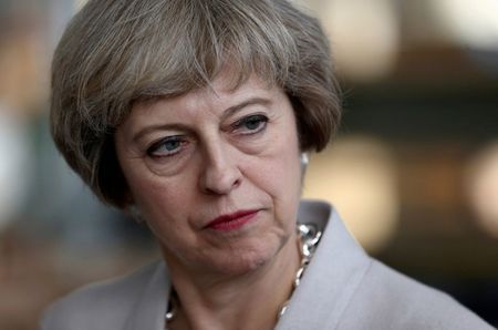 Britain's Prime Minister Theresa May visits a joinery factory in London