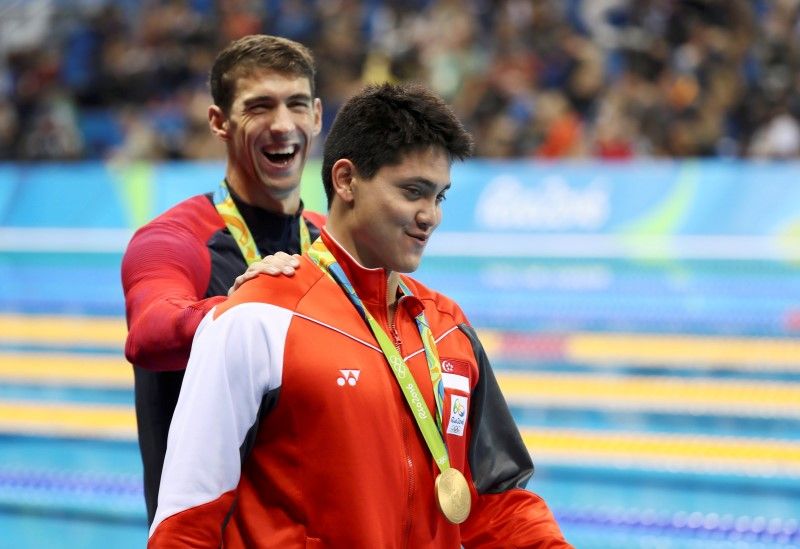 Michael Phelps congratulates Joseph Schooling