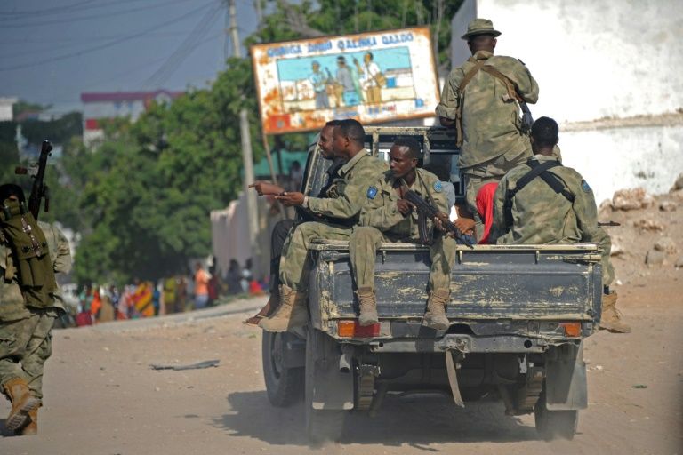 Somali soldiers patrol in a pickup truck in Mogadishu