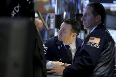 Traders work on the floor of the NYSE