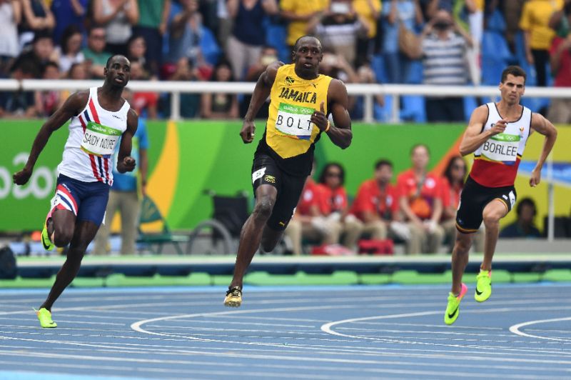 Usain Bolt competes in the men's 200m round 1 at the Olympic Stadium in Rio de Janeiro