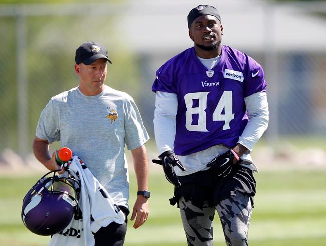 Minnesota Vikings wide receiver Cordarrelle Patterson is escorted off the field with a trainer after Patterson was shaken up during the first day of the NFL football team's training camp at Mankato State University in Mankato Minn. on Friday J