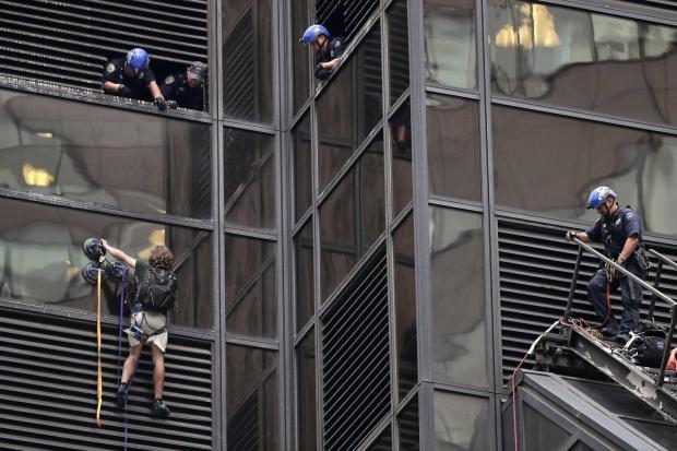 Man is trying to scale Trump Tower in NYC using suction cups