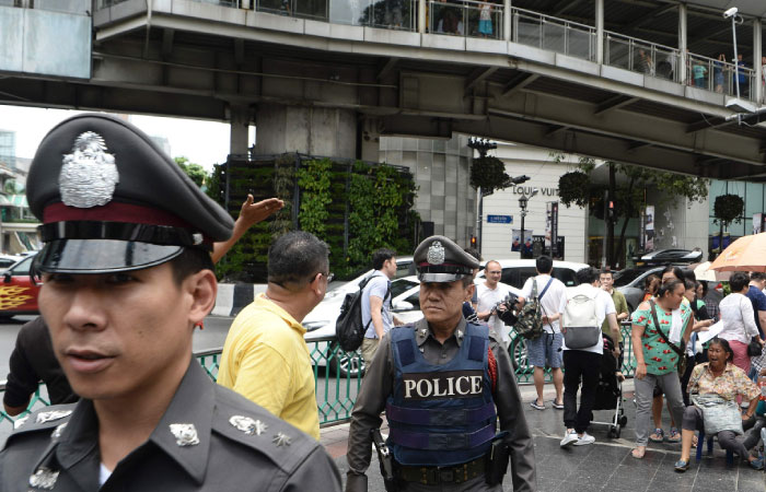 Thai police patrol the area near the Erawan Shrine the site of a bombing in August 2015 that left 20 dead and scores injured in the center of Bangkok on Saturday as authorities increase security following a new string of bomb attacks in Thailand. — AF