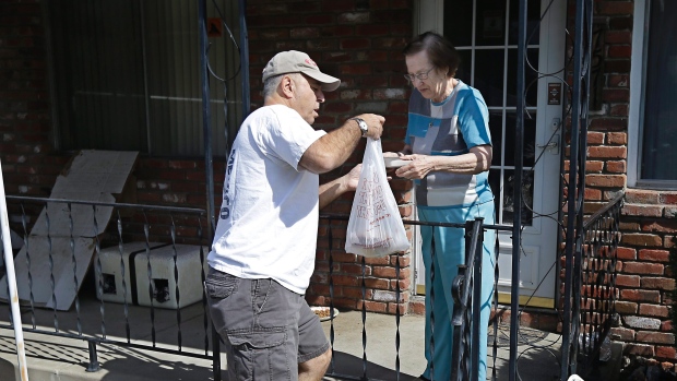 Bob Gill a volunteer driver with Meals on Wheels By ACC delivers lunch to Thelma Pense in California last year. Some who volunteers could have a larger social network more power and more prestige that in turn may lead to better physical and mental hea