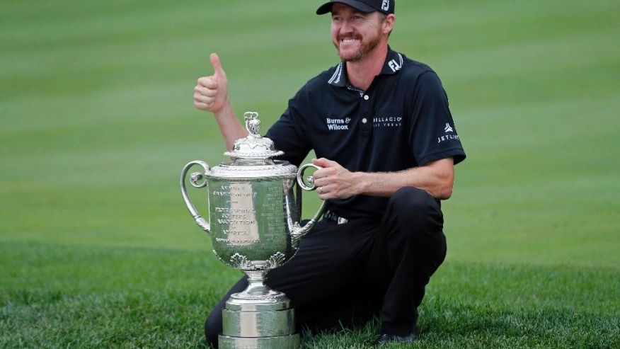 Jimmy Walker poses with the trophy after winning the PGA Championship golf tournament at Baltusrol Golf Club in Springfield N.J. Sunday