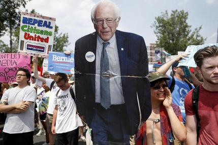 Supporters of Sen. Bernie Sanders I-Vt. march during a protest in downtown on Monday