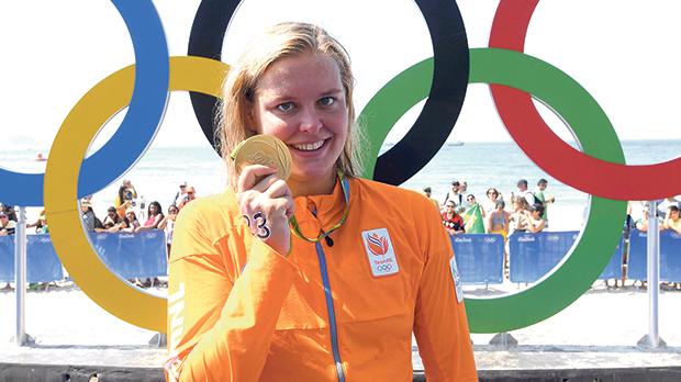 Sharon van Rouwendaal shows her gold medal after winning the women’s swimming marathon yesterday