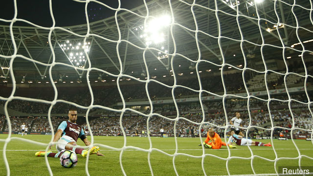 FC Astra Giurgiu's Filipe Teixeira scores their first goal as West Ham United's Winston Reid looks