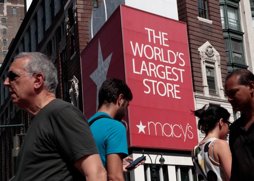 588424834-people-walk-past-macys-flagship-store-in-herald-square