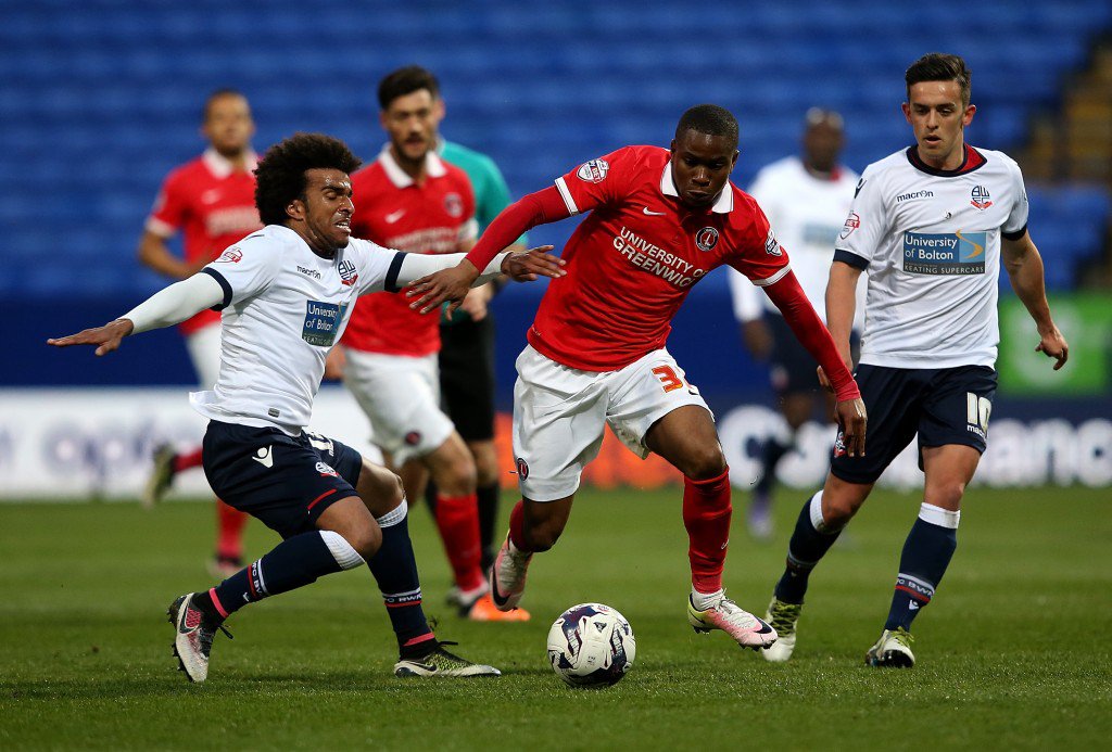 BOLTON ENGLAND- APRIL 19 Mark Davies of Bolton Wanderers battles with Ademola Lookman of Charlton Athletic during the Sky Bet Championship match between Bolton Wanderers and Charlton Athletic at Reebok Stadium