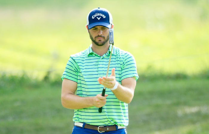 Wesley Bryan lines up a putt on the first green during the second round of the John Deere Classic in Silvis Illinois Friday. — AFP