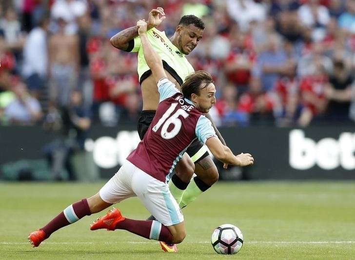 Britain Soccer Football- West Ham United v AFC Bournemouth- Premier League- London Stadium- 21/8/16 Bournemouth's Joshua King in action with West Ham United's Mark Noble Action Images via Reuters  Carl Recine Livepic