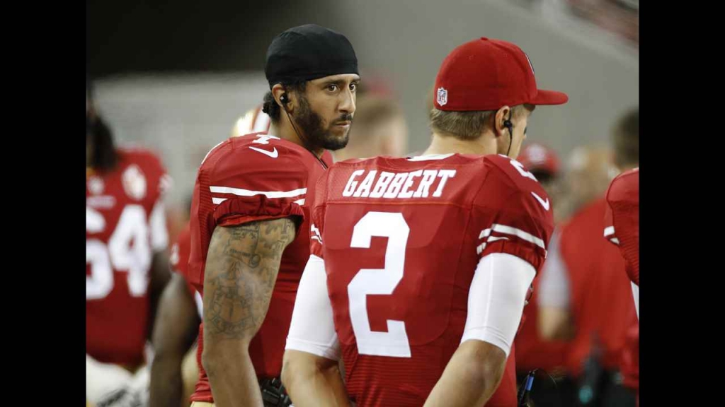 San Francisco 49ers quarterbacks Colin Kaepernick left and Blaine Gabbert stand on the sideline during the 2nd half of an NFL preseason football game against the Green Bay Packers on Friday Aug. 26 2016