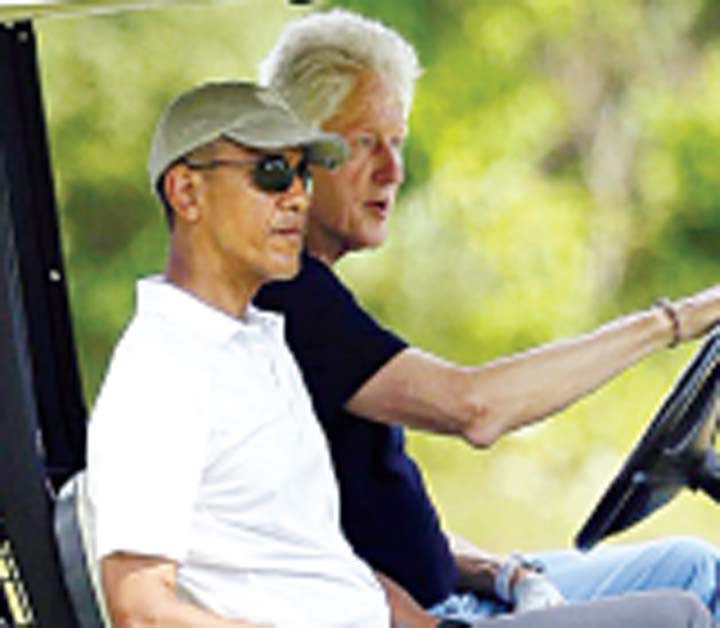 President Barack Obama front left and former President Bill Clinton ride in a cart while golfing at Farm Neck Golf Club in Oak Bluffs Massachusetts. on the island of Martha’s Vineyard Aug. 15 2015