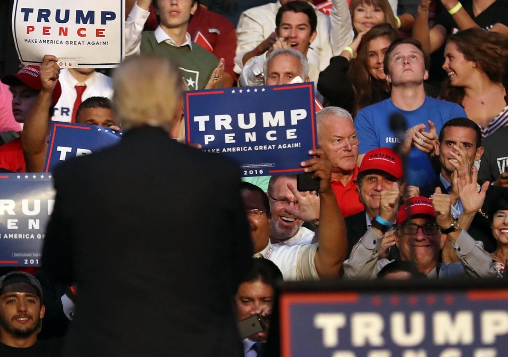 Trump knocks Clinton's proximity to father of Orlando shooter - with a disgraced ex-congressman sitting behind him