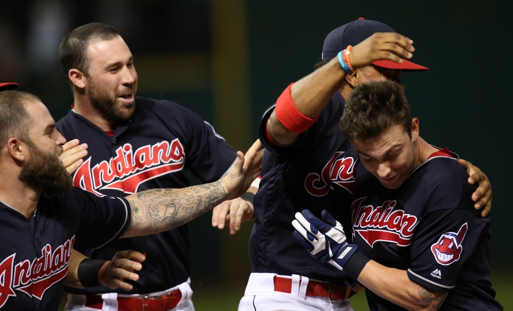 Tyler Naquin right is mobbed by teammates after hitting the game-winning single in the ninth inning against the White Sox on Thursday Aug. 18 2016 in Cleveland. The Indians won 5-4