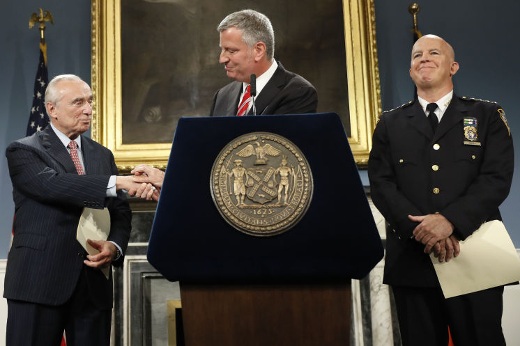 New York City Mayor Bill de Blasio center is joined by Police Commissioner William Bratton left and police Chief James O’Neill during a news conference on Tuesday