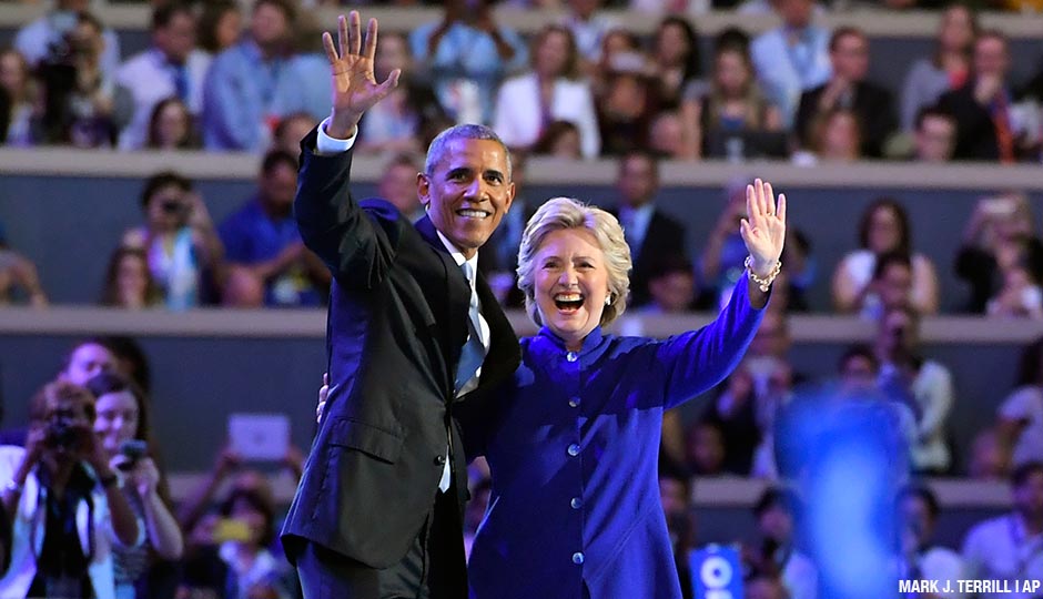 President Barack Obama and Democratic Presidential candidate Hillary Clinton wave together during the third day of the Democratic National Convention in Philadelphia, Wednesday