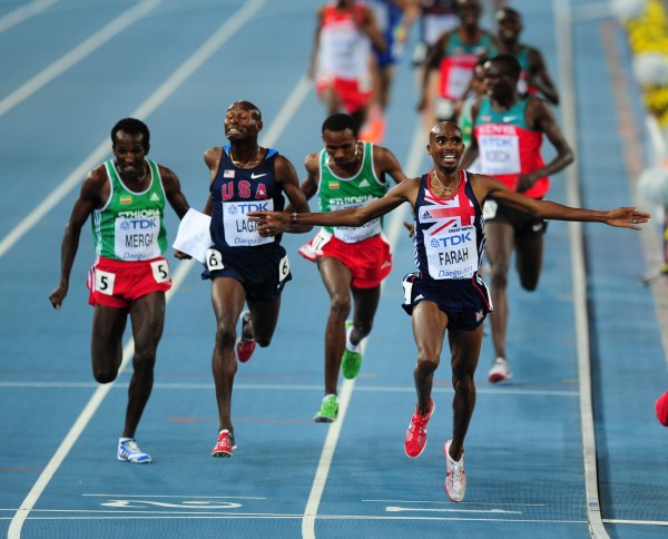 Mo Farah crosses the line to win the men's 5,000m final at the 2011 World Championships