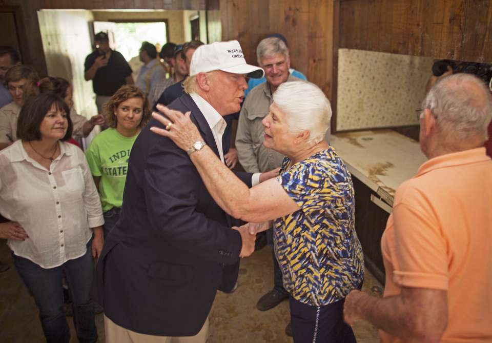 Trump tours flood damage as campaign reels from shakeup