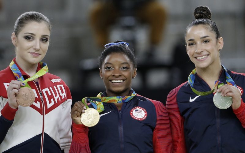 Bronze medallist Aliya Mustafina of Russia left gold medallist Simone Biles centre and US silver medallist Aly Raisman