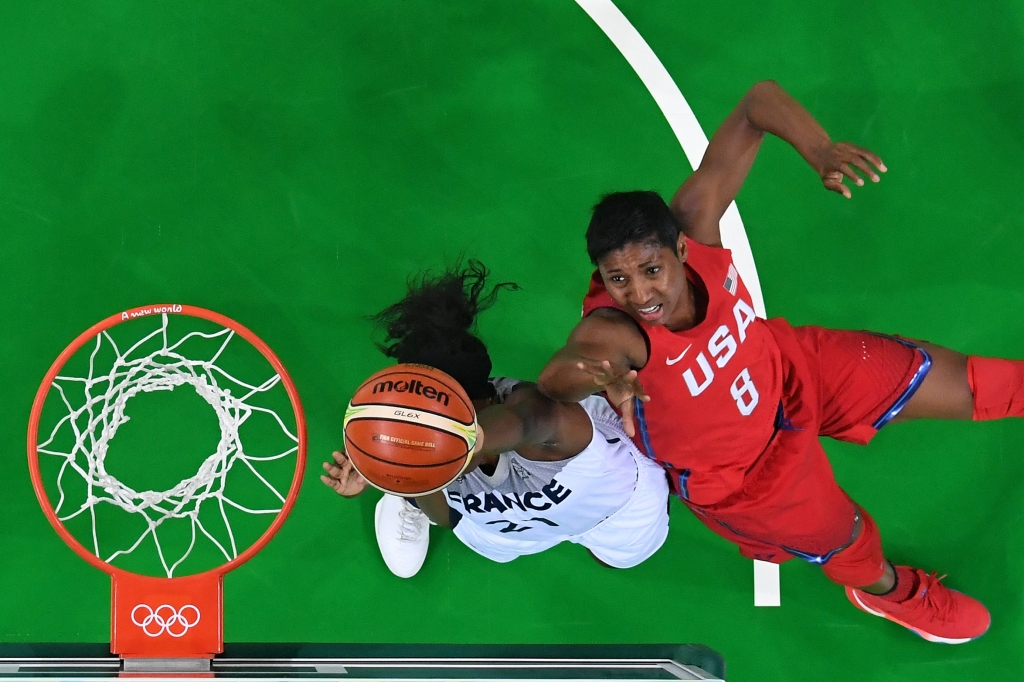 RIO DE JANEIRO BRAZIL- AUGUST 18 Angel Mccoughtry #8 of United States shoots against Laetitia Kamba #21 of France during a Women's Semifinal Basketball game between the United States and France on Day 13 of the Rio 2016 Olympic Games at Carioca A